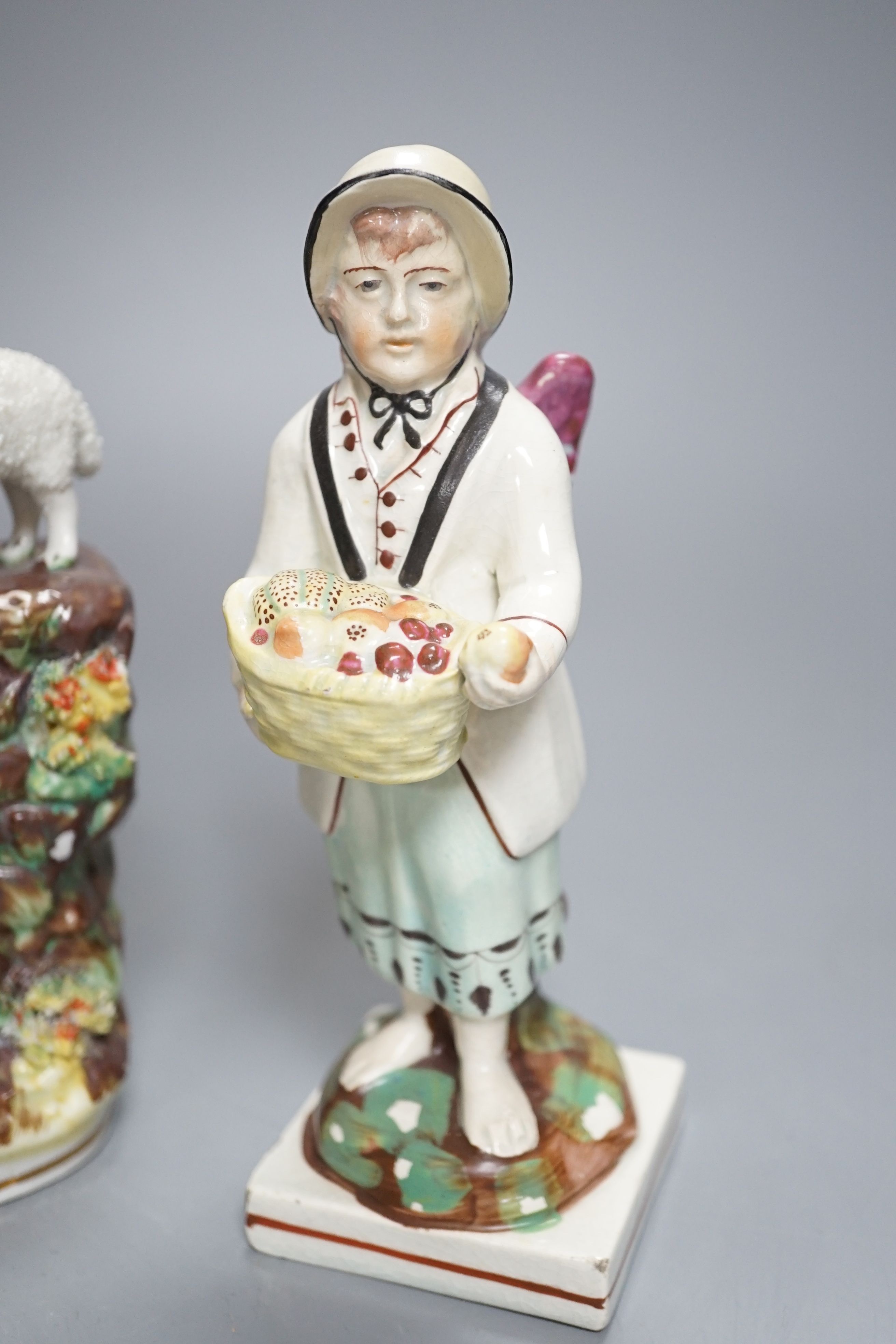 A Chelsea-Derby bocage figure, 16cm, 19th century pearlware figure of Cupid disguised and one other Staffordshire figure